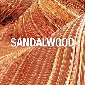 Curve label detail highlighting ingredients like black pepper and sandalwood
