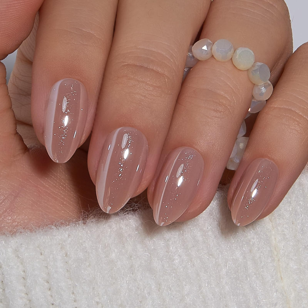 CurvLife front packaging showing medium almond nude nails and included kit benefits