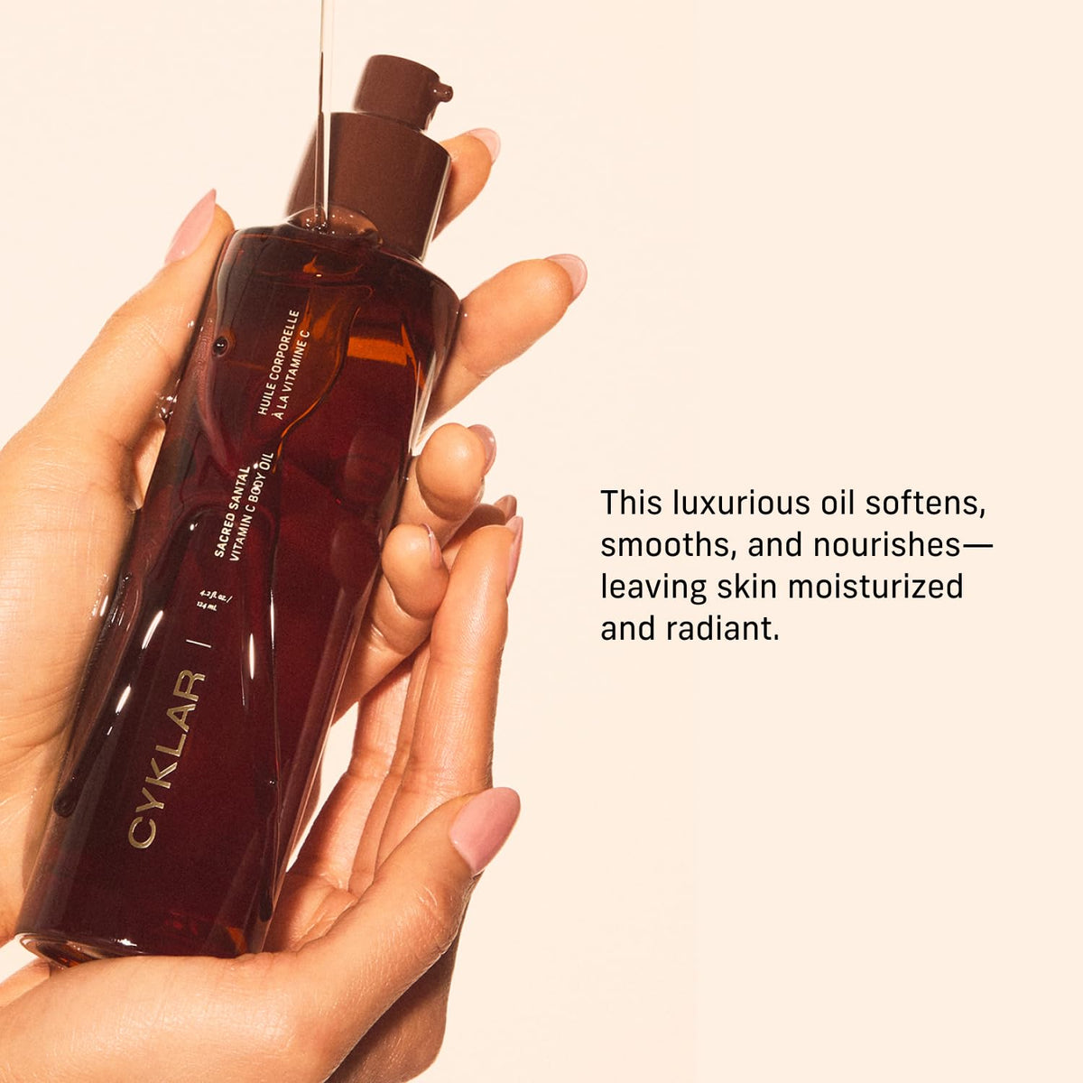 CYKLAR applying body oil on forearm after shower for hydrated skin