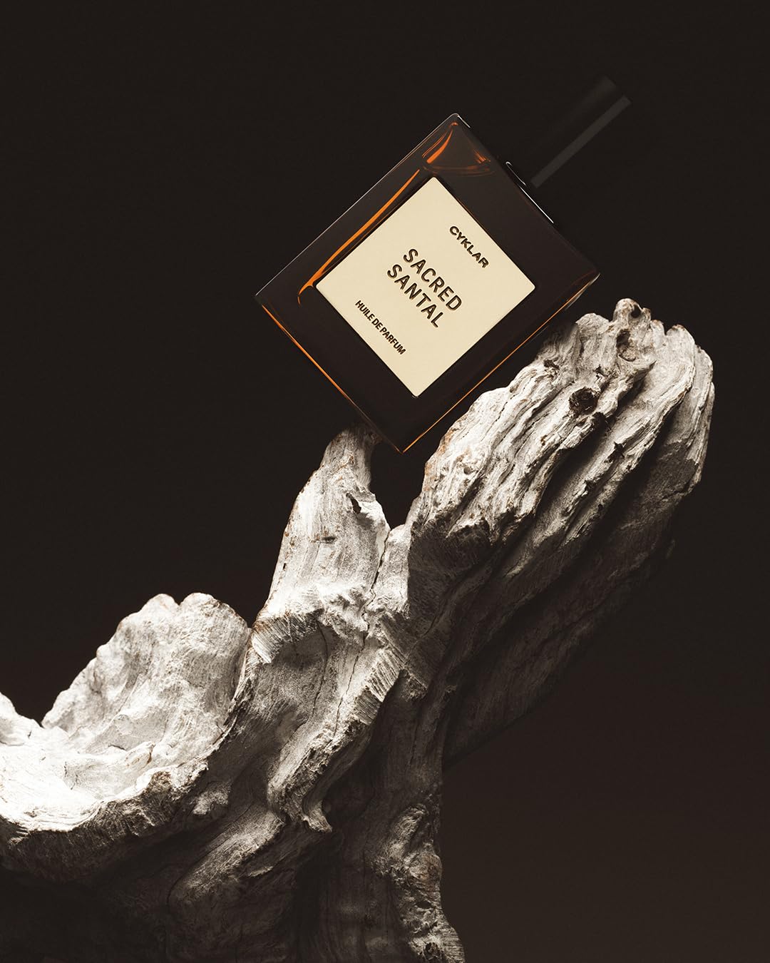 CYKLAR Sacred Santal oil texture drop illustrating creamy sandalwood emollience