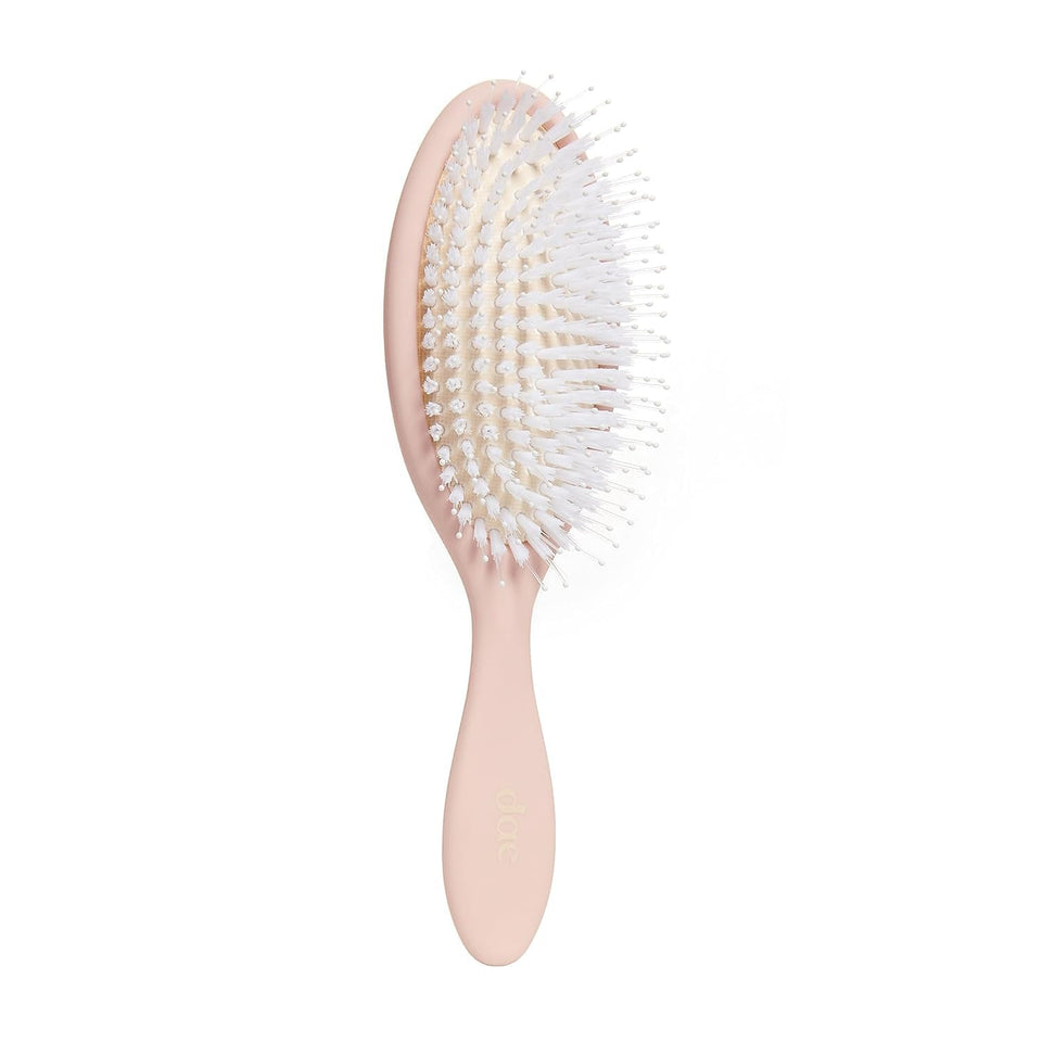 DAE brush front view showing ergonomic shape and sleek finish for easy styling