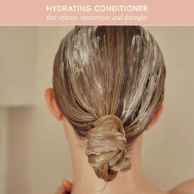 DAE conditioner placed on bathroom shelf suggesting effortless daily use benefit