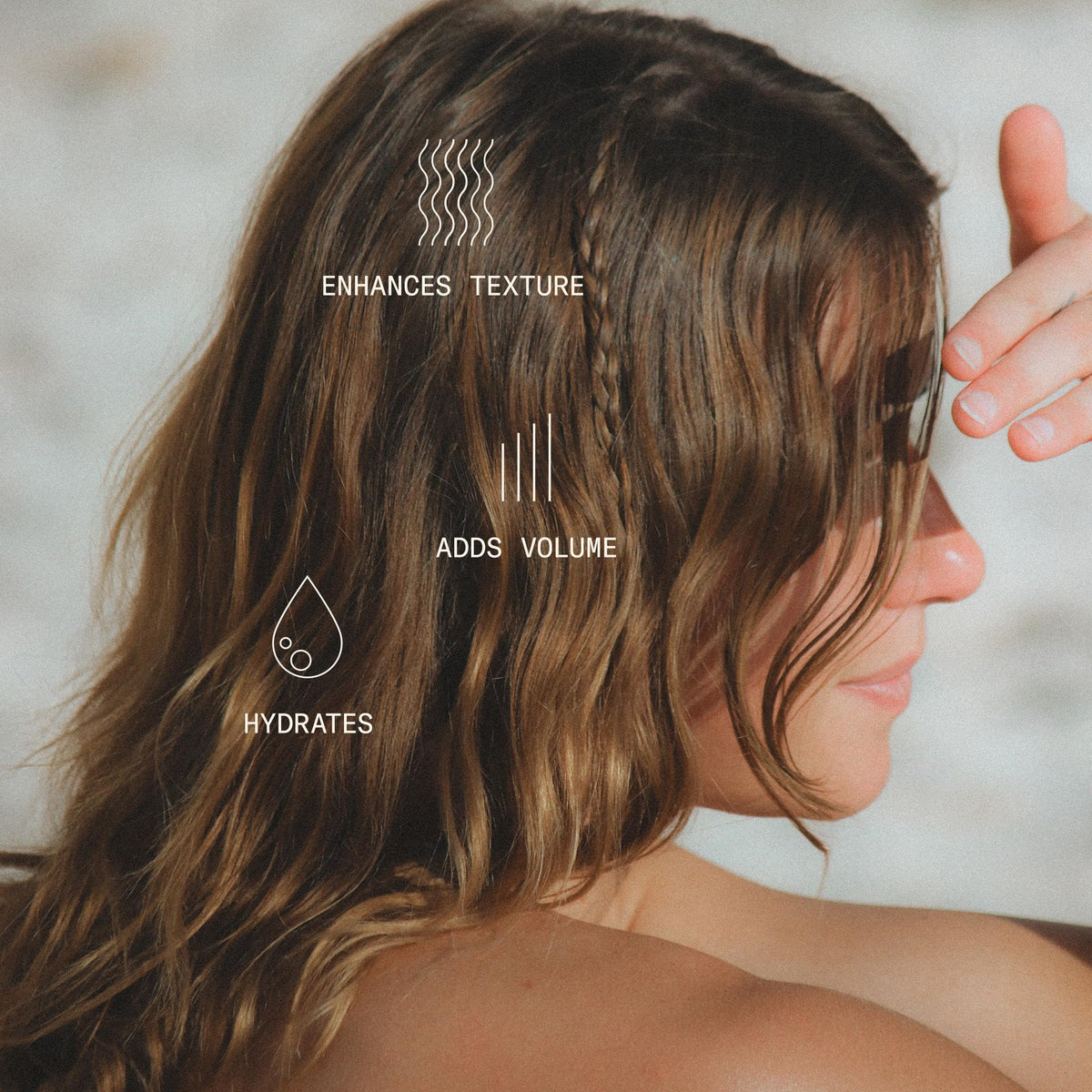 DAE bottle spraying mist into air demonstrating fine texture and even application benefit