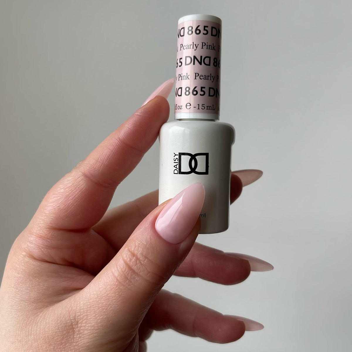 DAISY DND lifestyle manicure on hands showing natural pearly pink for everyday elegance