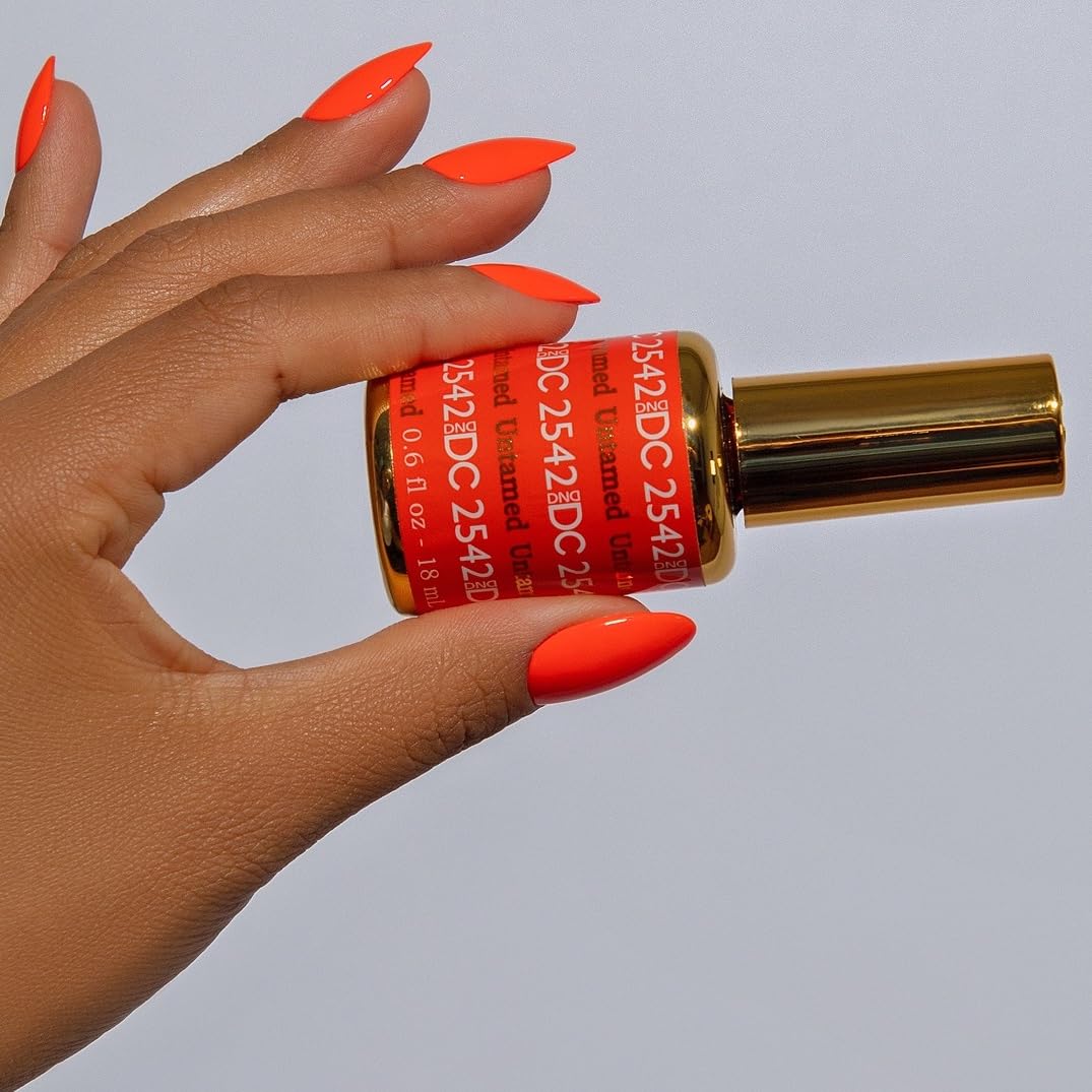 DAISY DND brush stroke swatch of Untamed showing neon warm red-orange payoff