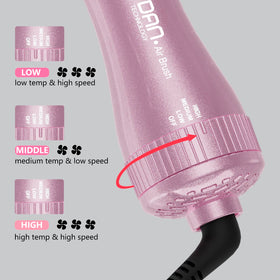 DAN Technology brush held in hand showing scale, lightweight portability benefit
