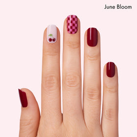 Dashing Diva close-up of Cha Cha Cherry strip pattern highlighting glossy finish and playful design