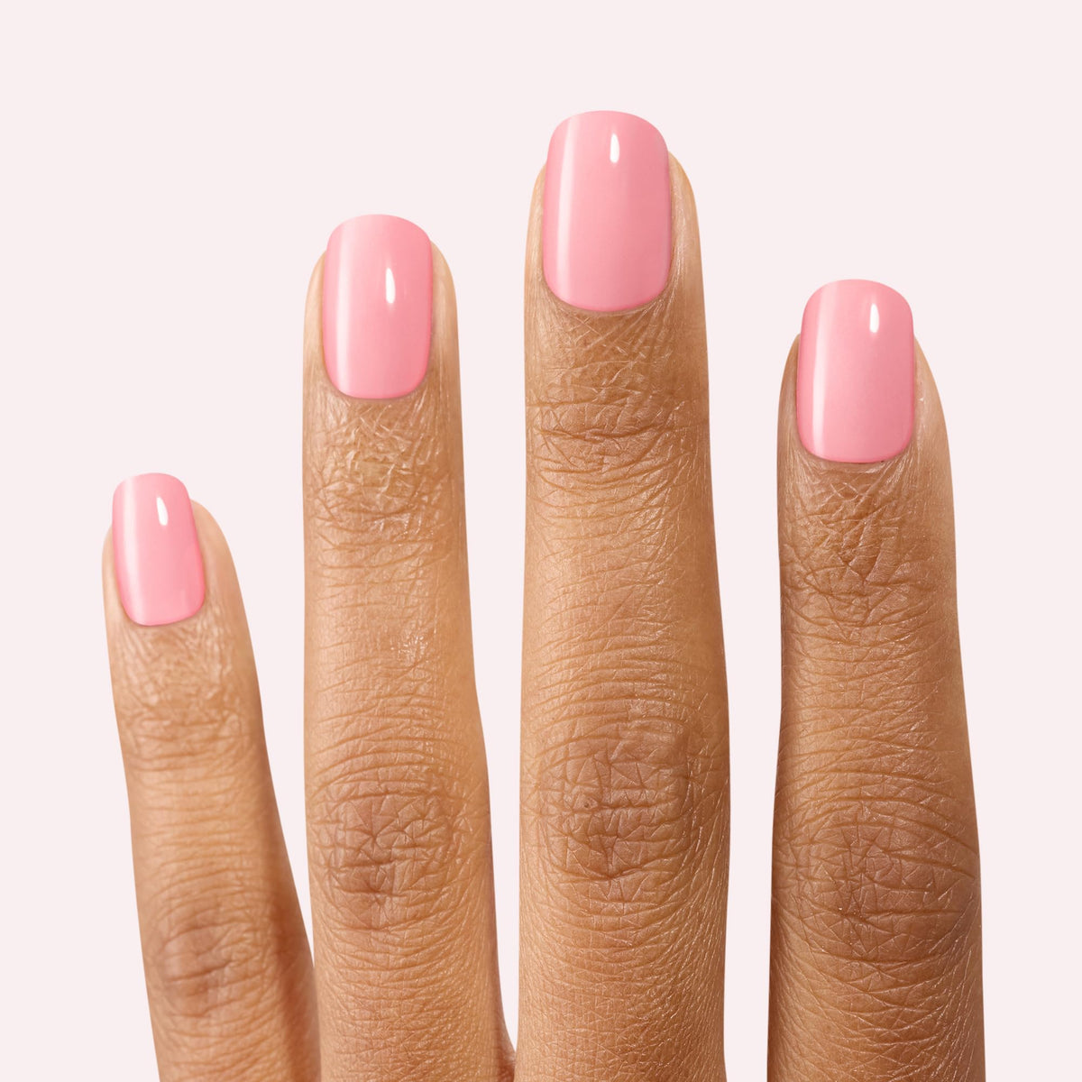 hand wearing Dashing Diva strips being pressed down to demonstrate fast application benefit
