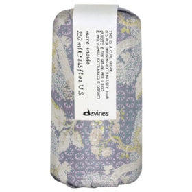 Davines gel-to-oil texture swatch on hand, showing creamy hydration and smooth finish