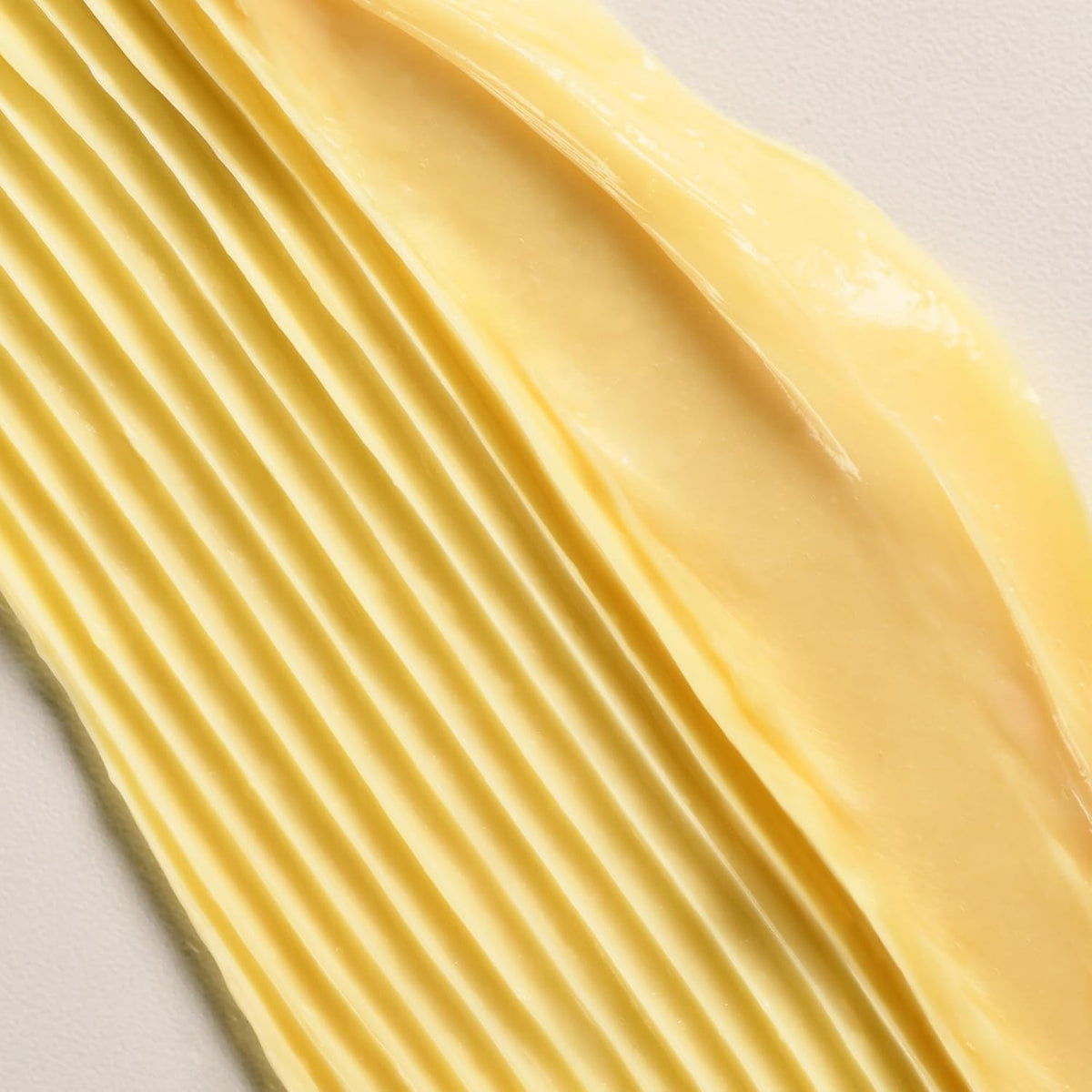 Applying Davines DEDE to hair mid-lengths for detangling and softness benefit