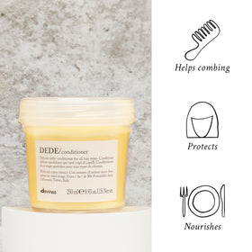 Rinsing hair after Davines DEDE to show weightless finish and shine benefit