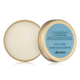 Davines open jar showing smooth paste texture for easy workability and medium hold