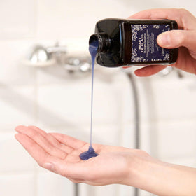 Davines stylist applying shampoo demonstrating salon results