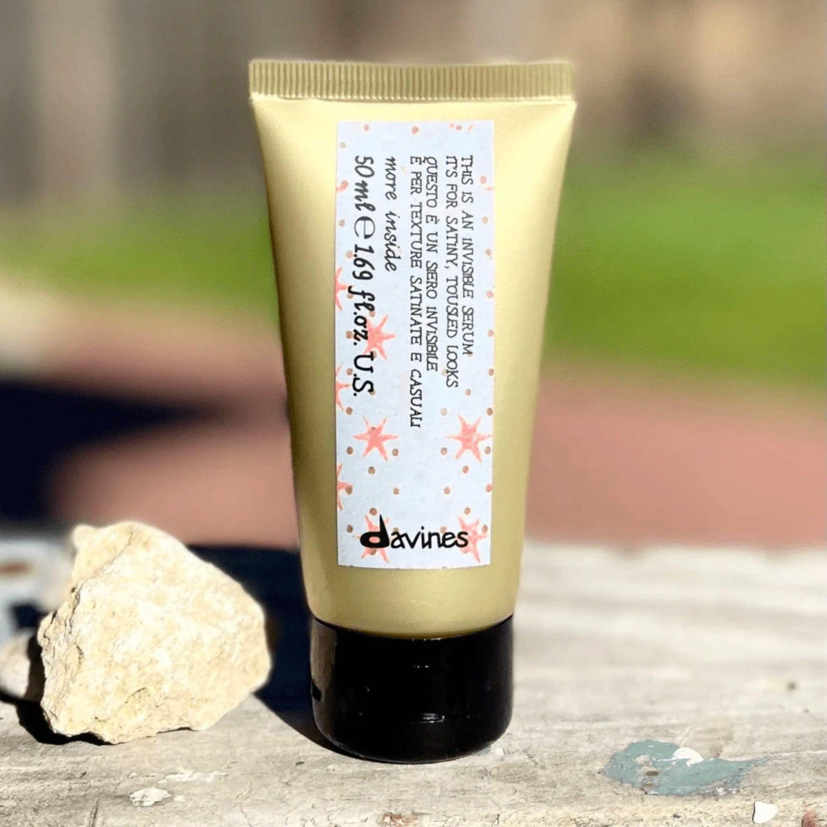 Davines serum inside travel kit illustrating portability and on‑the‑go use