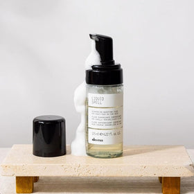 Davines Liquid Spell foam texture closeup, showing airy foam that creates weightless body
