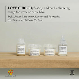 Davines LOVE curl shampoo travel size in hand illustrating portability and convenience