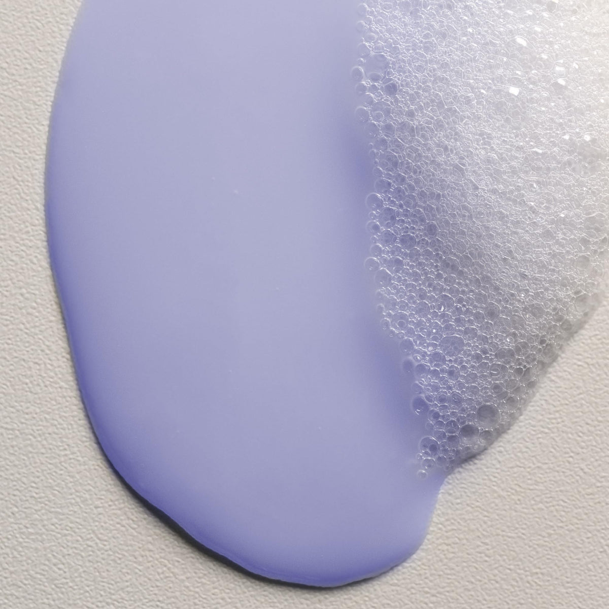 Davines shampoo in shower scene demonstrating in-use frizz control benefit