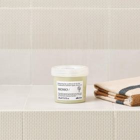 Davines MOMO conditioner with apricot extract close-up highlighting moisturizing source
