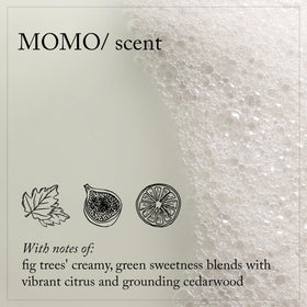 Person applying Davines MOMO conditioner in shower for smoother, manageable hair