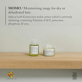 Davines MOMO conditioner applied in shower demonstrating easy rinsing