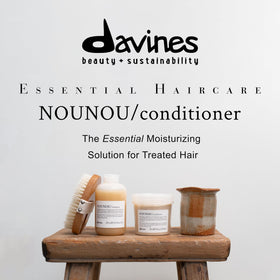Davines NOUNOU being poured onto hand demonstrating product slip and spreadability
