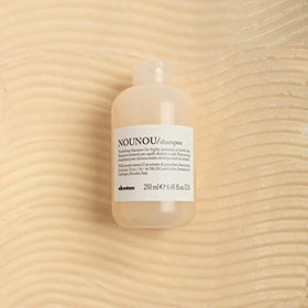 Davines NOUNOU pump and cap close-up highlighting easy dispensing