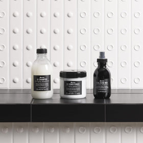 Davines OI before and after image controlling frizz and shine