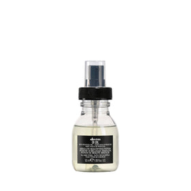 Davines OI Oil front bottle showing travel size and brand sheen benefit