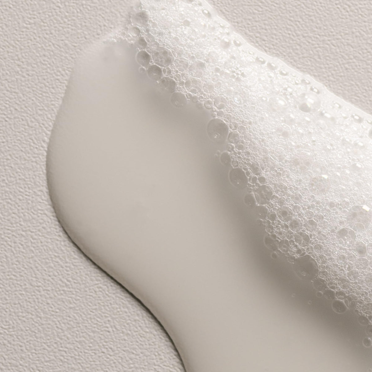 Davines OI shampoo bottle staged in bathroom for daily use