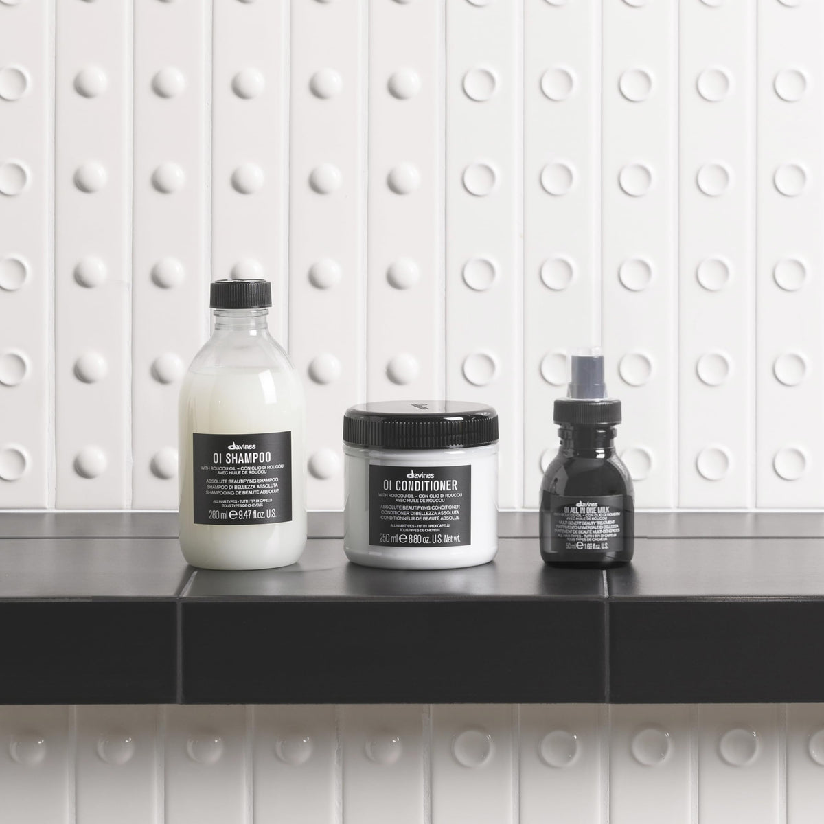Davines OI shampoo foam texture close-up showing rich lather and effective cleanse benefit