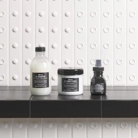 Davines OI shampoo foam texture close-up showing rich lather and effective cleanse benefit