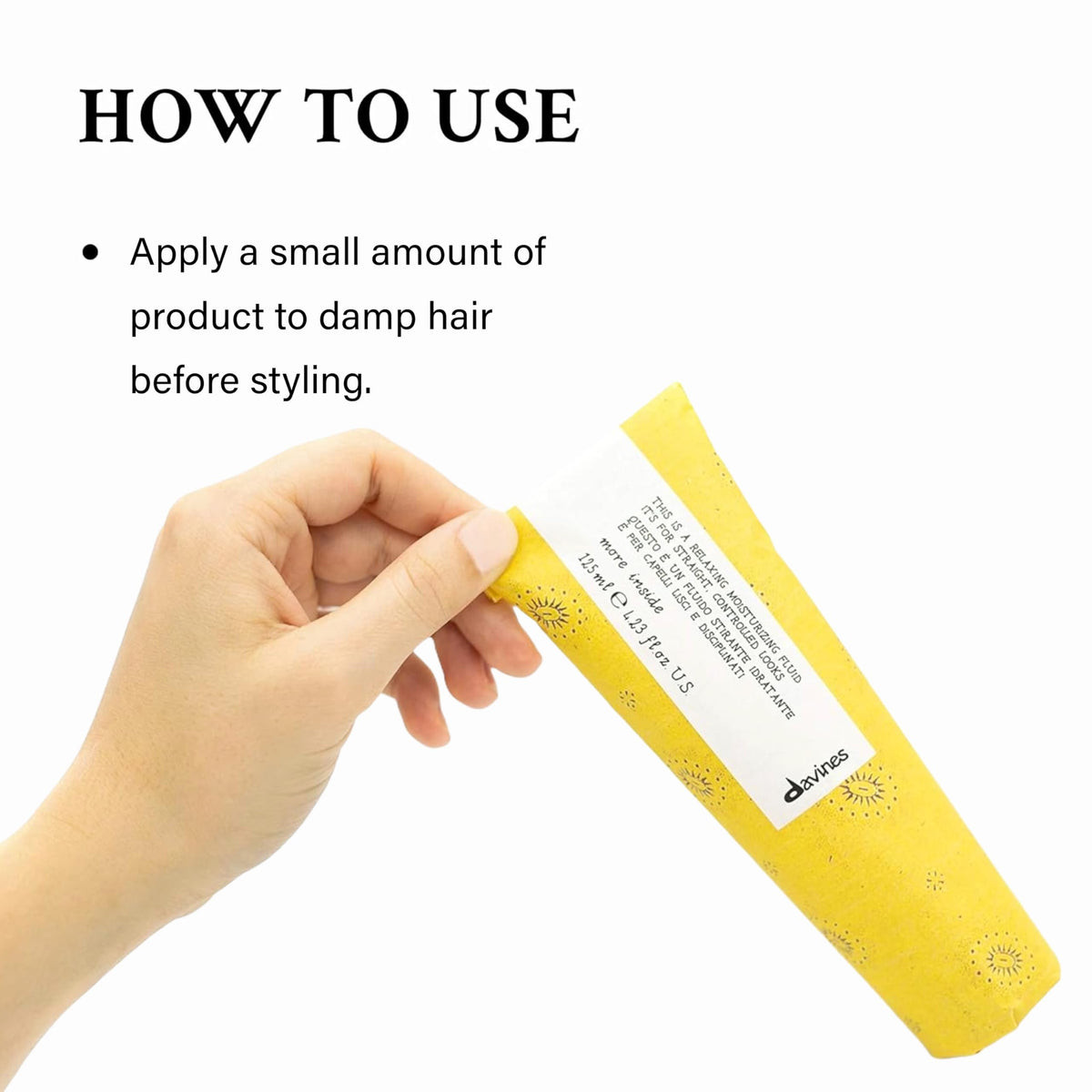 Applying Davines fluid to towel-dried hair to improve manageability and reduce frizz