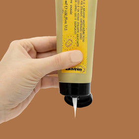 Davines fluid texture drop on hand highlighting lightweight texture and hydration benefit