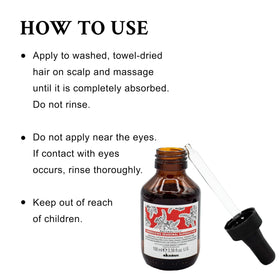 Davines travel-size bottle held to show compact scale for portability