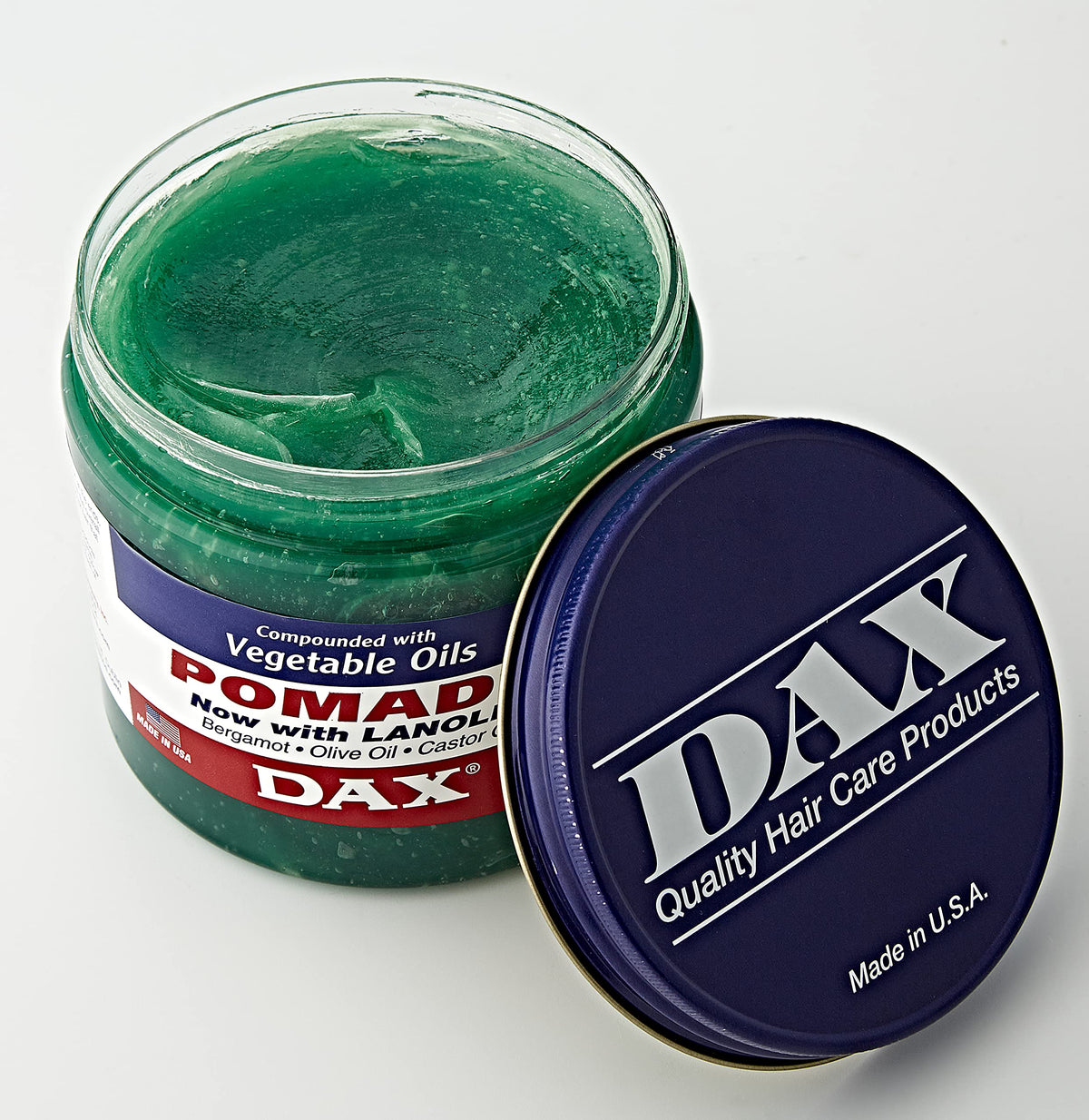 DAX open tin texture close-up showing creamy pomade for easy styling