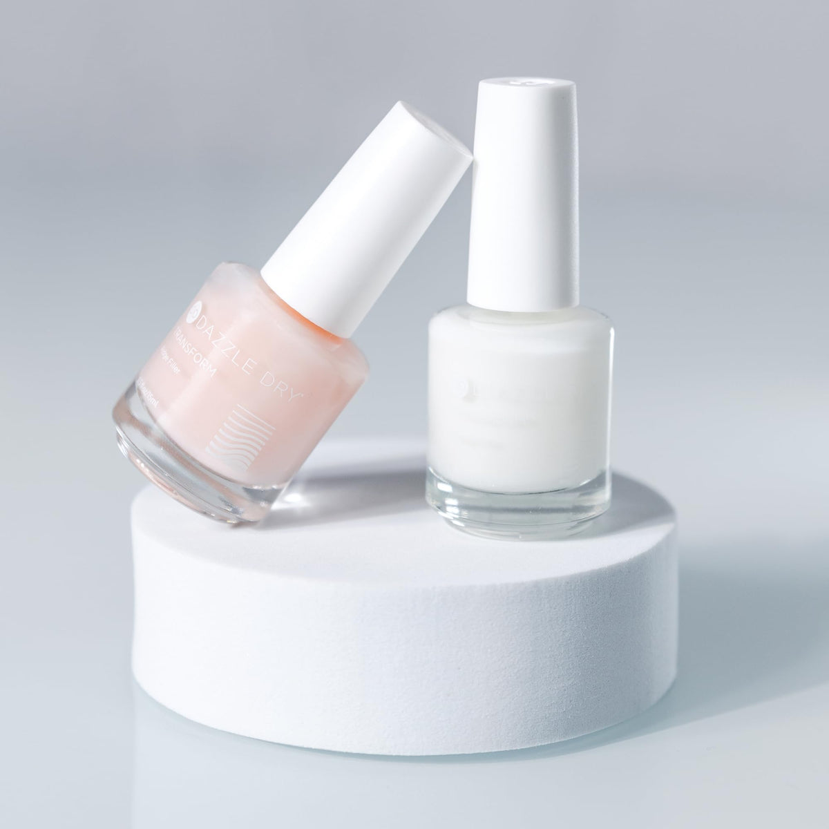 Dazzle Dry bottle next to ruler showing 0.5 oz size and travel-friendly benefit