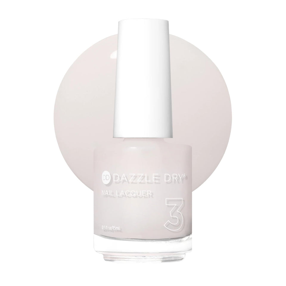 Dazzle Dry bottle front view showing soft pink shade and compact design