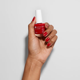 Natural nails painted with Dazzle Dry Rapid Red demonstrating chip resistance