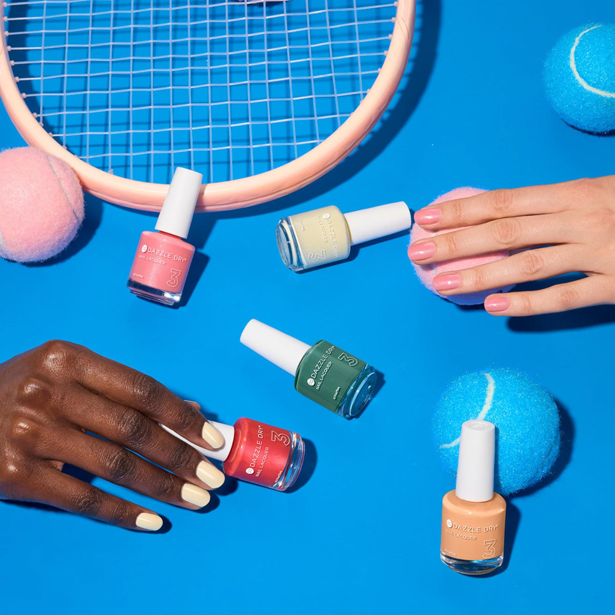 Dazzle Dry painted fingertips in lifestyle scene showing durable glossy look