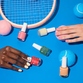 Dazzle Dry painted fingertips in lifestyle scene showing durable glossy look