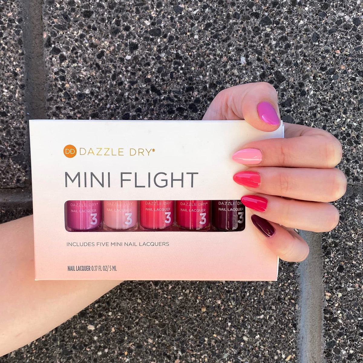 Dazzle Dry swatches on wrist showing true shade payoff for easy color selection