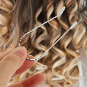 DDRAUY clips securing a hot roller in hair to show secure hold and reduced slipping during styling