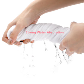 DEAYOU towel beside a hand showing large 15.7 x 23.6 inch scale benefit