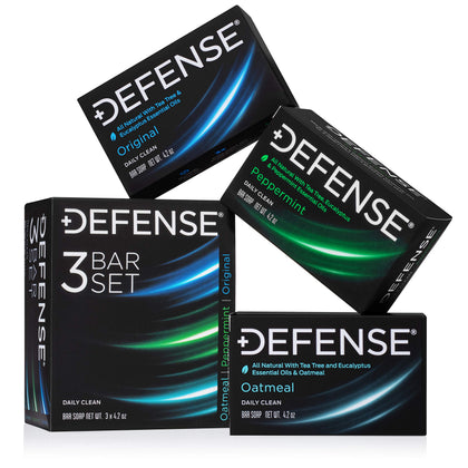 Defense Soap front packaging showing all three scent bars and benefits