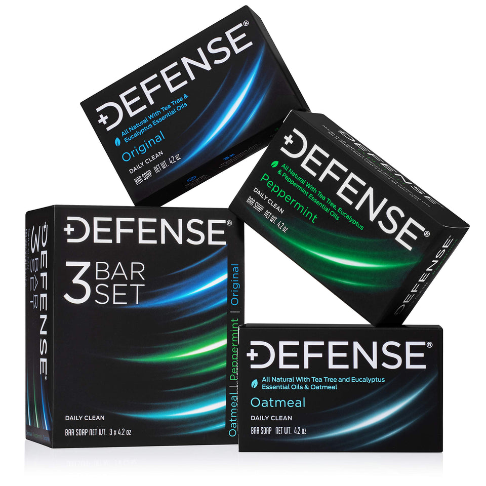 Defense Soap front packaging showing all three scent bars and benefits