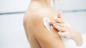 Del Indio Papago applying cream to arm to demonstrate targeted moisturization