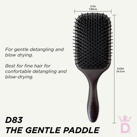 Denman close-up of round-tipped bristles minimizing hair breakage