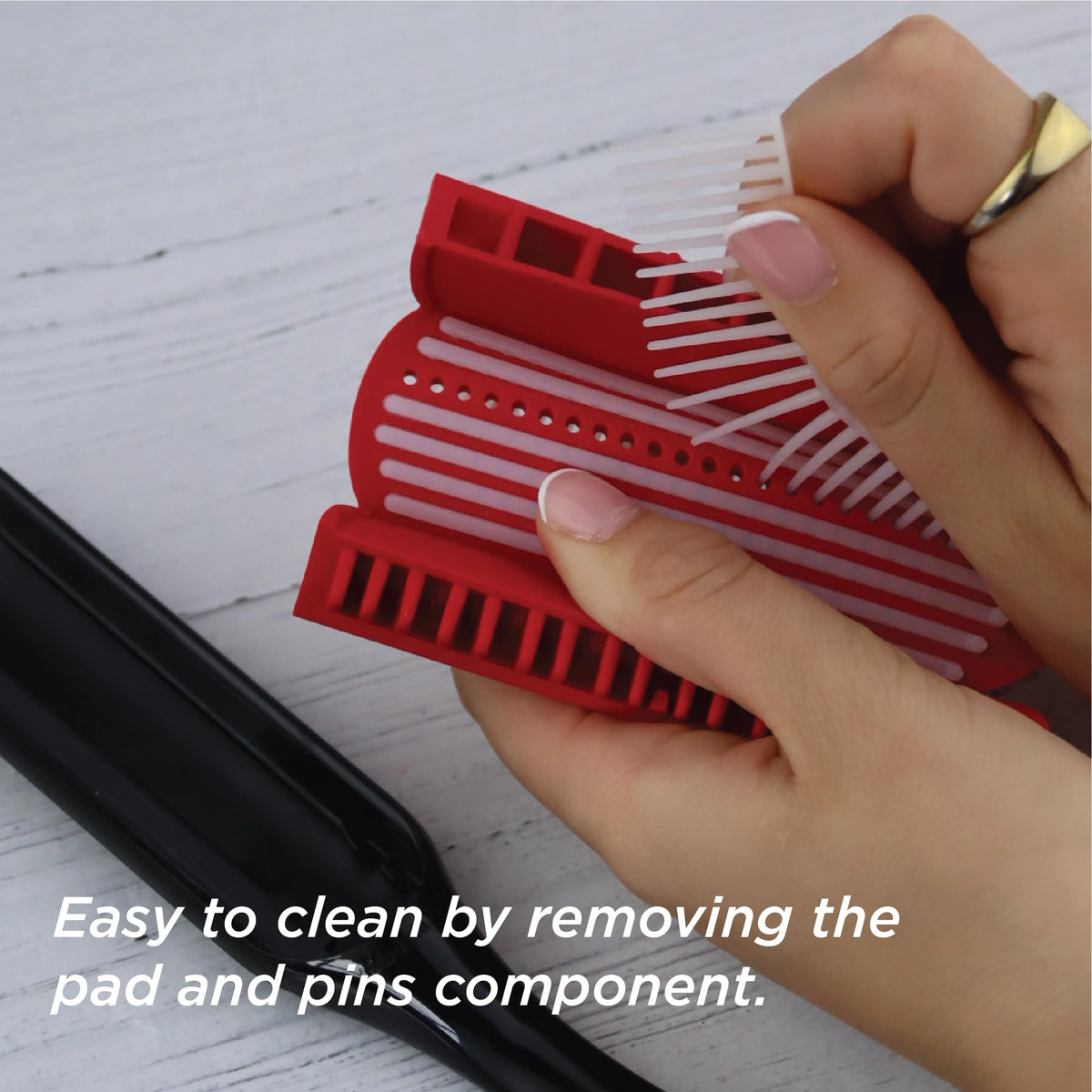 Detail of Denman brush handle showing comfortable grip and balanced styling control