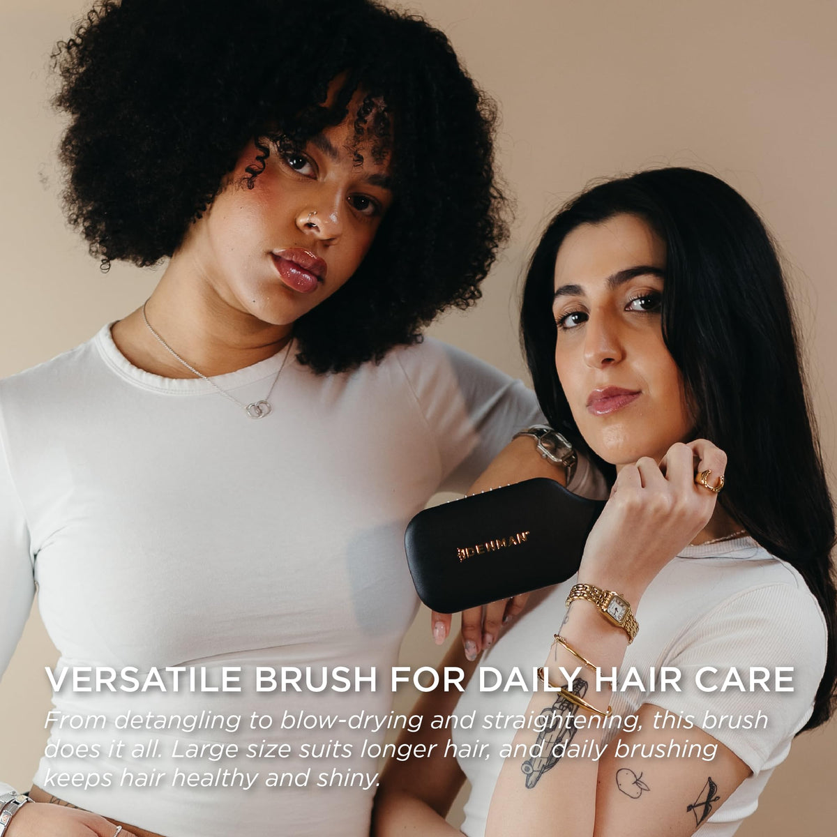 Denman brush held in hand to show size and balance benefit