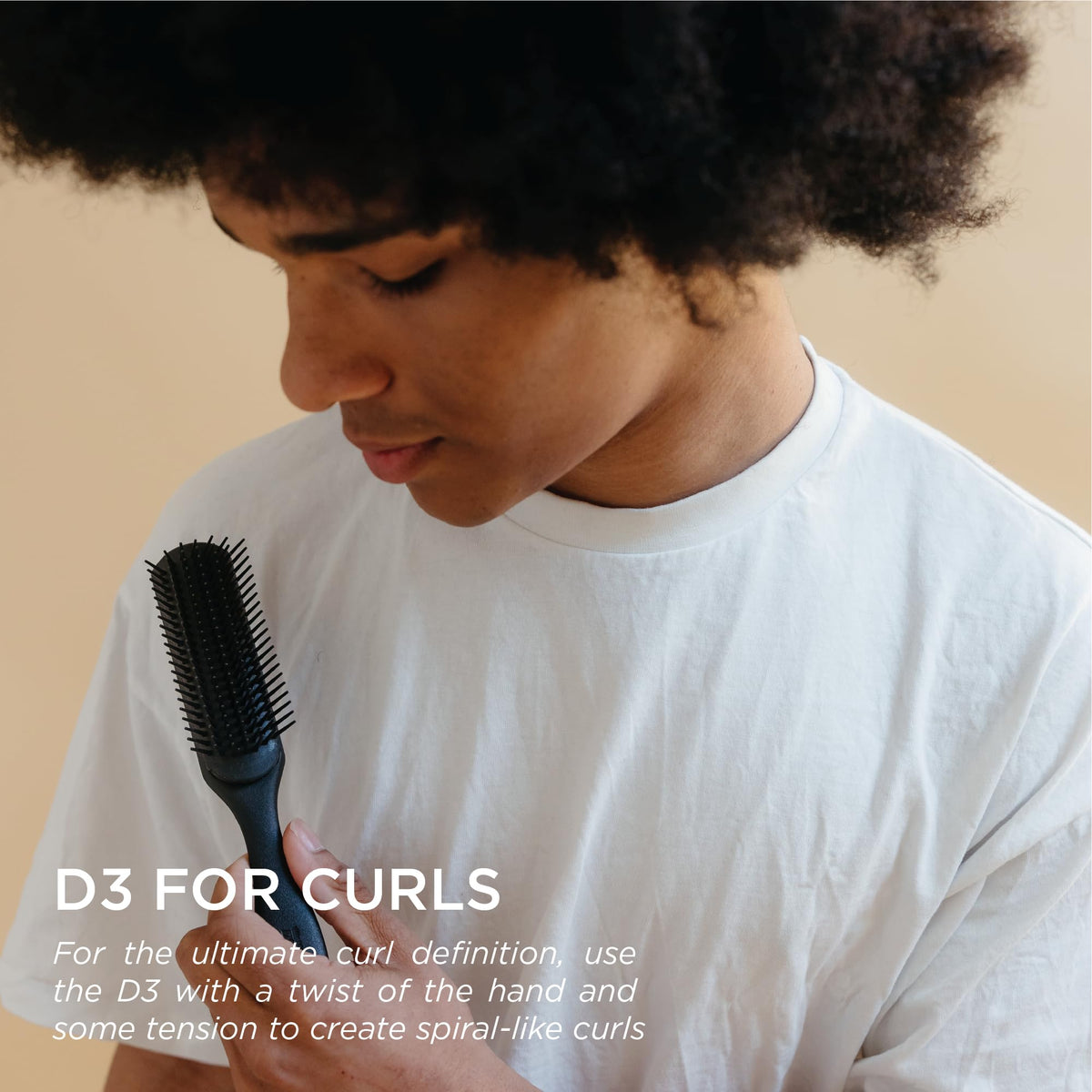 Denman D3 tear-drop handle highlighting ergonomic grip for better control